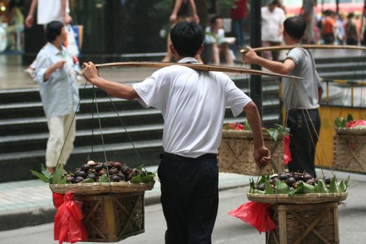 Typical street scene of chinese saling fruits