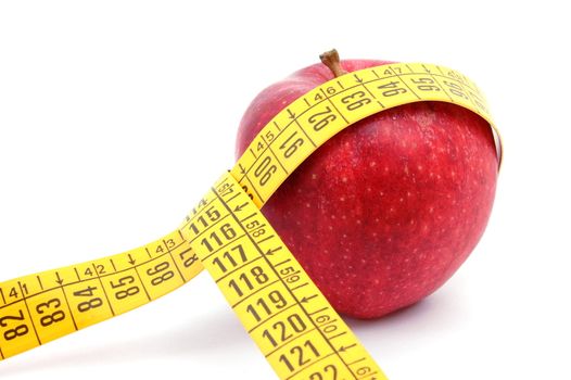 apple and measuring tape isolated on white background