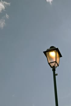 The included lantern on a background of the day time sky