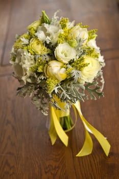 Image of a beautiful floral bouquet on wood table