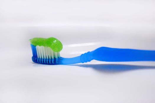 toothbrush and paste background white washstand