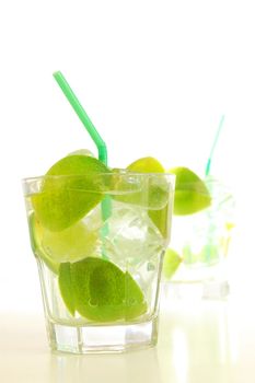 Caipirinha cocktail with lime on white background