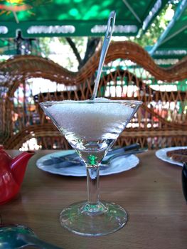 Glass with sugar and the spoon in cafe