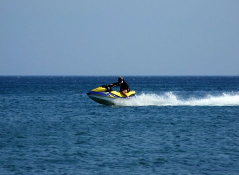 The men goes for a drive on a wave runner on sea waves 1