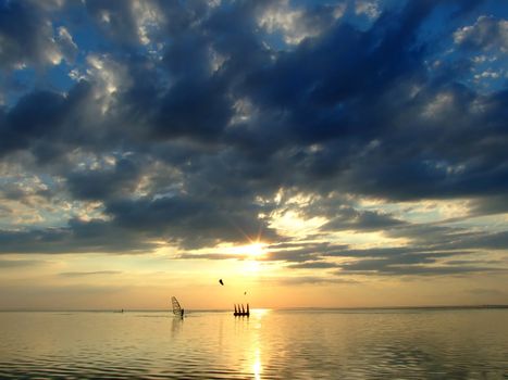 The sky and the sun in clouds above a gulf 2