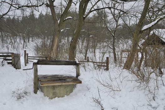 well with water in rural locality in winter