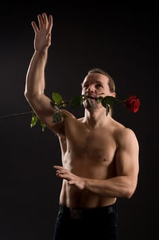 clambering romantic man with red rose

