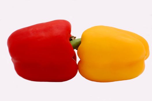 red and yellow peppers isolated on the white background