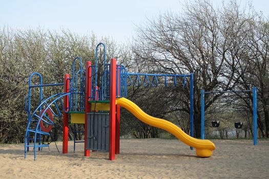 Colorful children's playground on a spring sunny day.