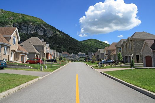Street leading to the mountain in a rich suburban neighborhood.