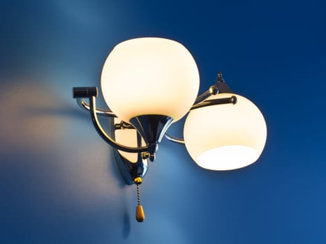 Lamp on a blue wall