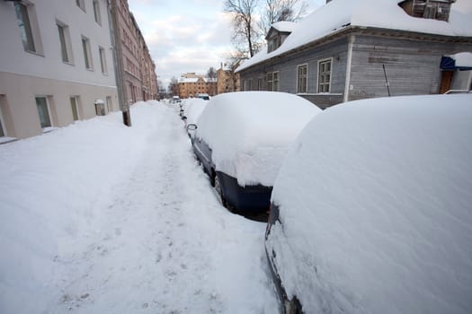 Snow covered cars after heavy snowfall