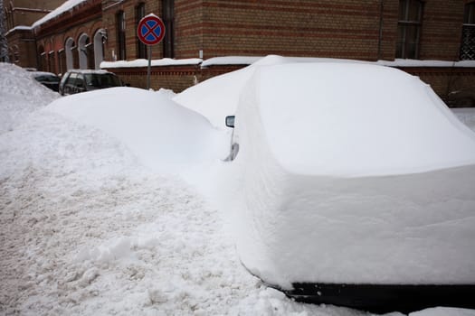 Snow covered cars after heavy snowfall