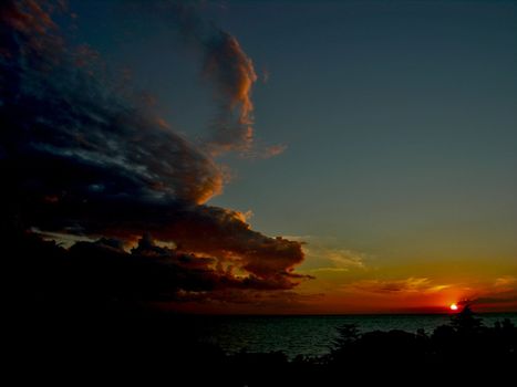 sunset with dragon cloud wich hunts for sun