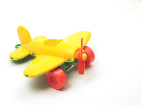 Yellow toy airplane isolated on white