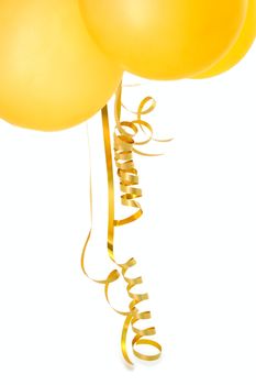Orange balloons with gold twisted ribbons on overwhite background.