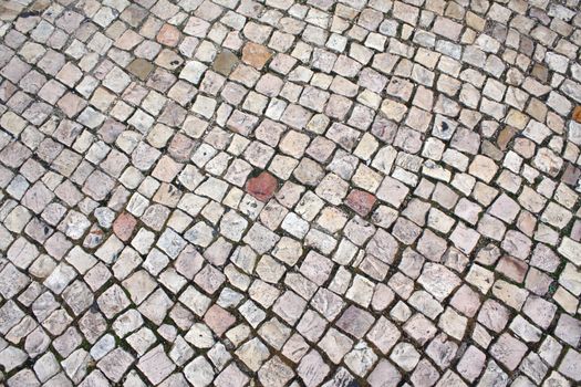 Typical cobblestoned street in Portugal suitable as a background.