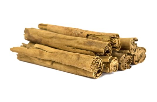 Cinnamon sticks isolated over a white background.
