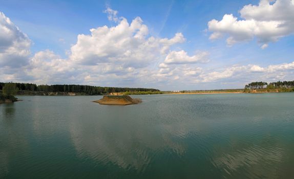 Beautiful summer landscape with the lake and little island (panorama)