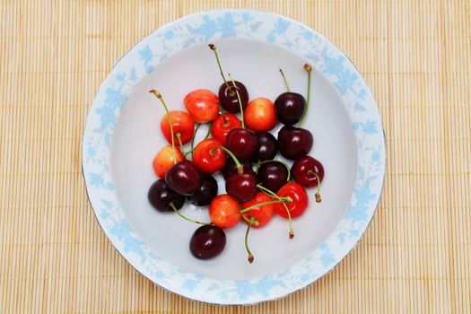 Sweet cherries on the plate