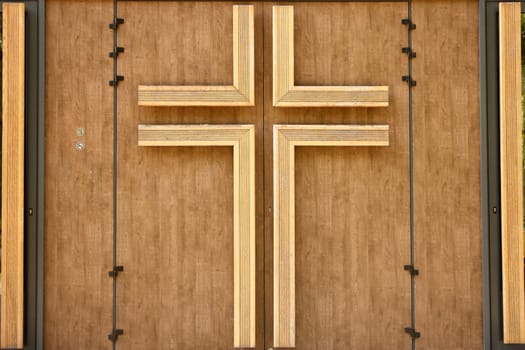 Church wooden door with crucifix