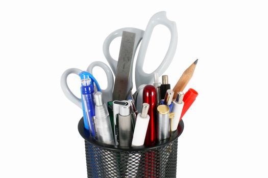 Black metal pencil cup filled with colorful used pencils, pens and scissors, isolated