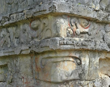 This is a Mayan face carved into a temple located at Tulum Mexico.       