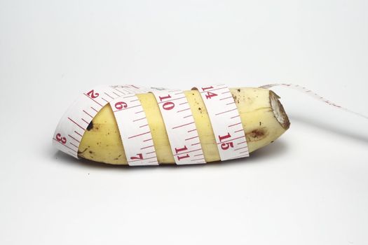Banana with tapemeasure for Diet Concept in a white background