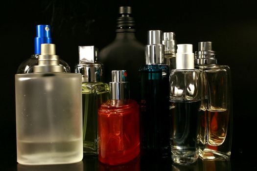 perfumes and fragrances bottles in black background