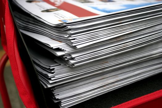 some fresh newspapers waiting to be taken away
