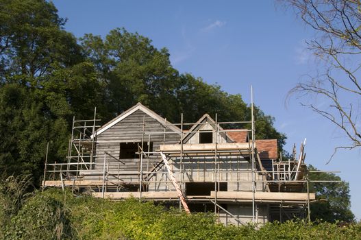 Scaffolding around  the back of a new house in the countryside