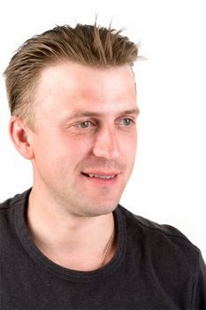 Portrait of the young smiling man. Face close up.