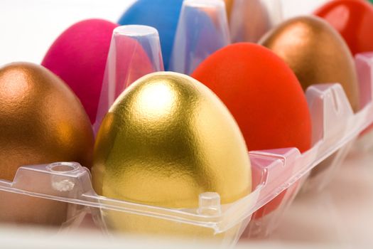 Traditional multicolored Easter eggs in plastic container