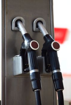 Fuelling gas nozzles on gasoline filling station