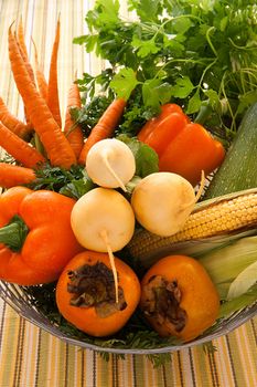 Autumn raw vegetables in wickered metal basket