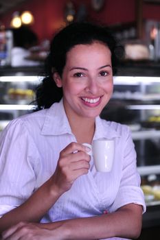 beautiful having a coffee break at a pastry shop