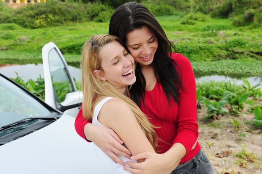 two happy women on car trip