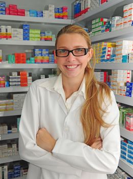 portrait of a female pharmacist at pharmacy