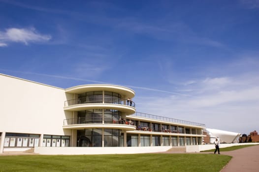 An Art-deco building with a  a blue sky