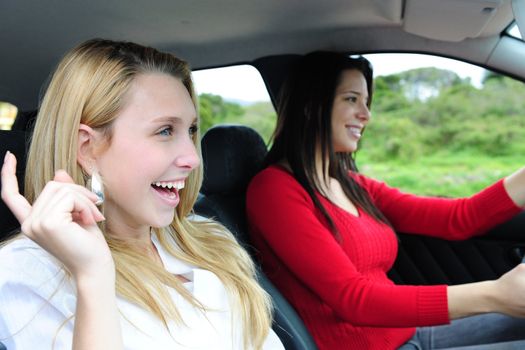 two happy women in a car