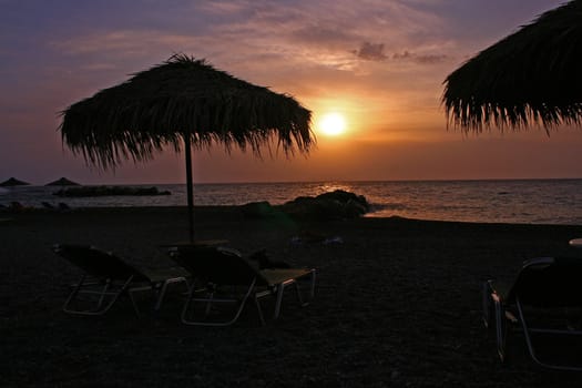 sunset on the beach on Santorini island in Greece