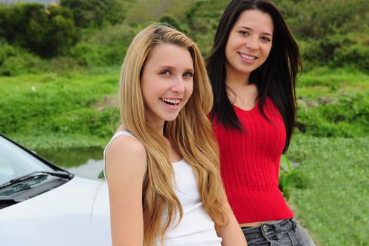 two happy women on car trip