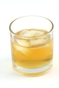 glass with whiskey on the rocks isolated on white background