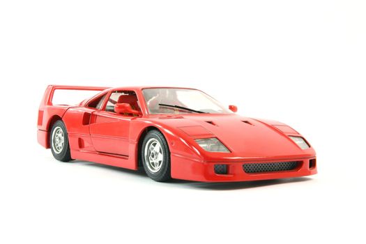 red sports car miniature isolated on white background