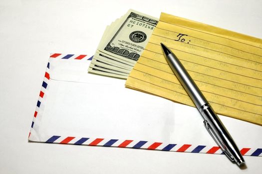 Hundred dollar in yellow paper letter enclosed in an  envelope.