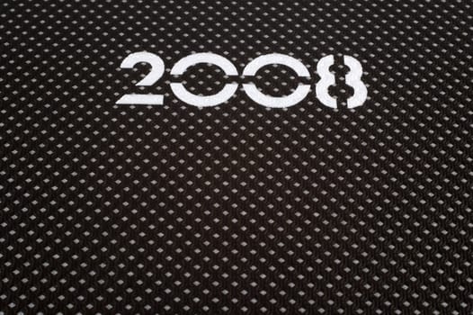 Close up of number 2008 printed on dark agenda cover