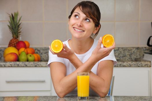 woman drinking fruit juice in the kitchen