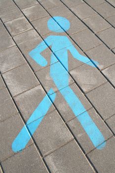 Walking area. Pedestrian sign painted on the pavement.