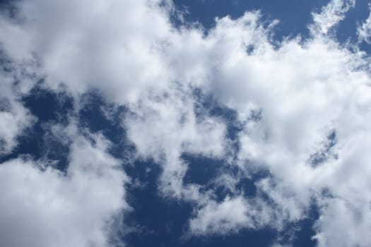 Blue sky and white clouds background.