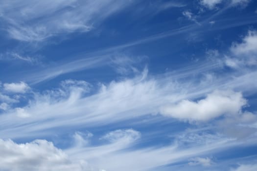 Curly white clouds in the friendly blue sky.